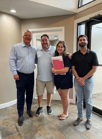 Stefano with clients after a closing
